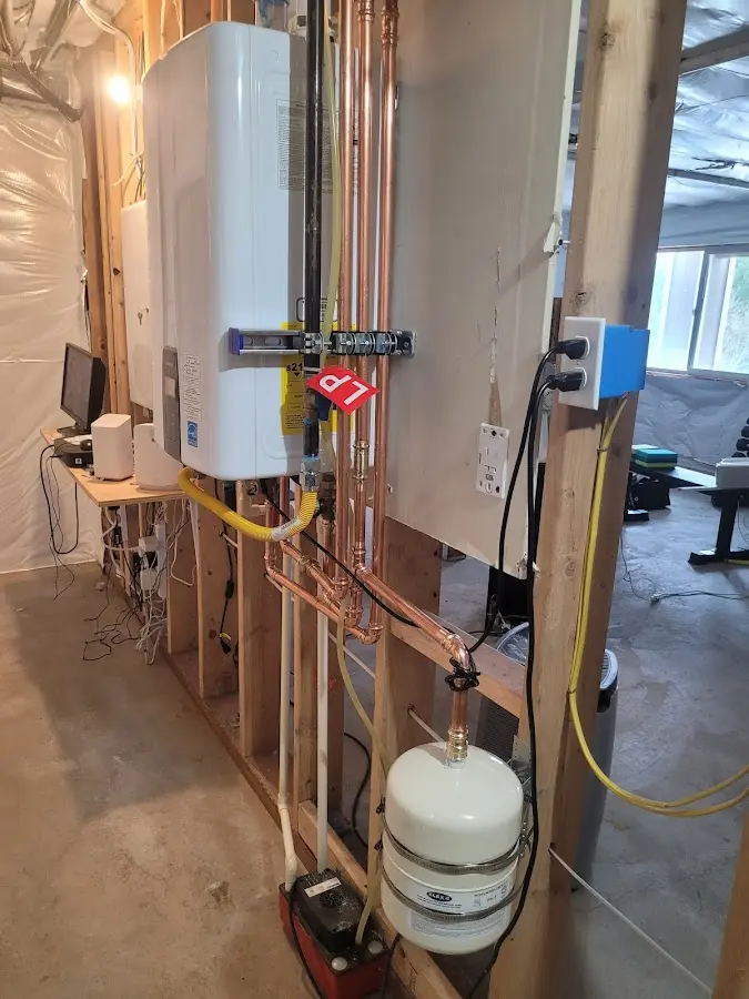 Licensed plumber repairing a kitchen sink in Elba